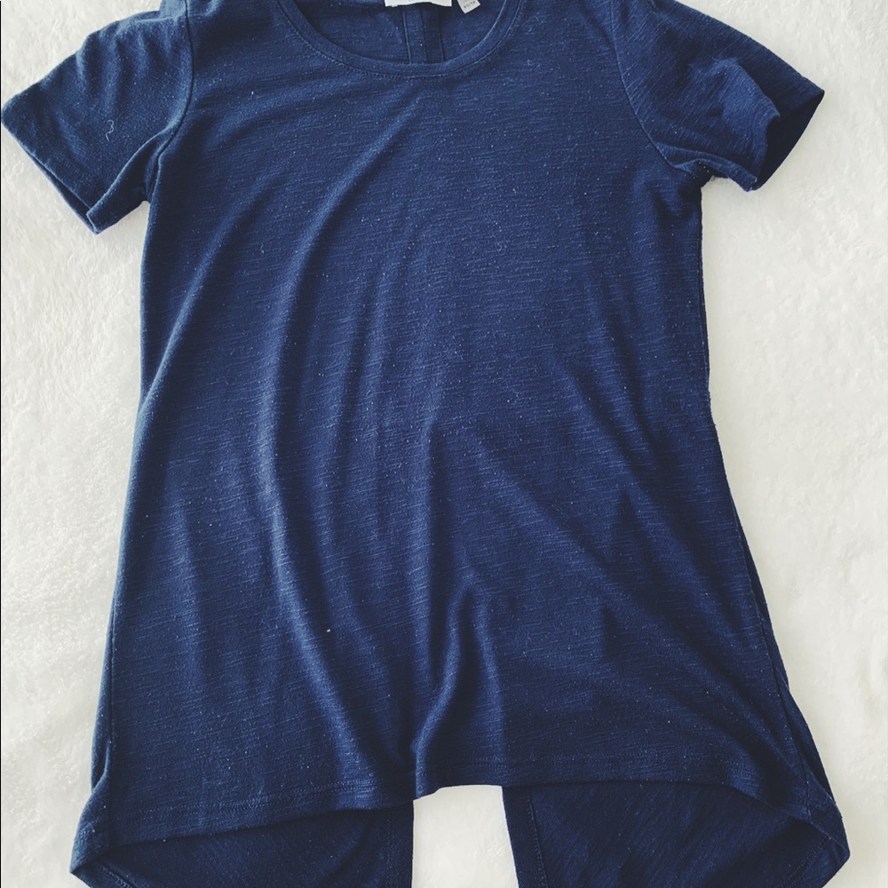 Brand new shirt with a slit in the back